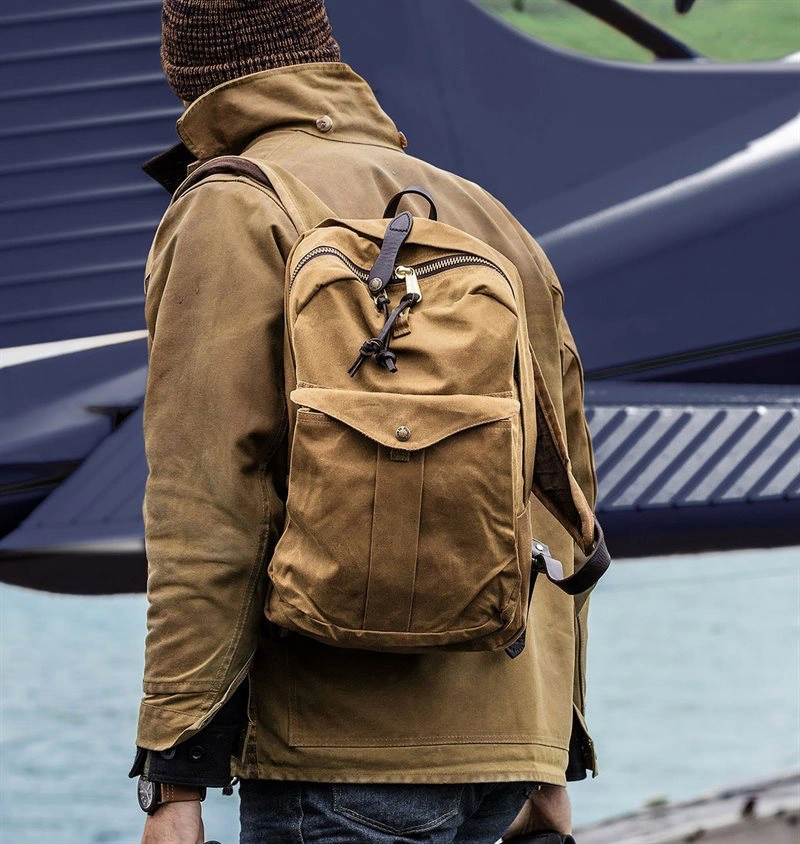 The Filson Journeyman in tan color on a tan jacket