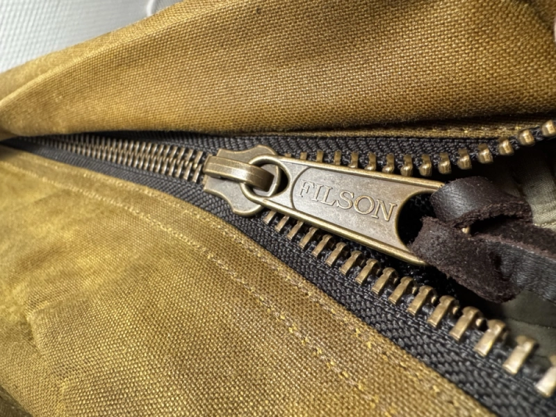 The Journeyman sports strong brasse zippers